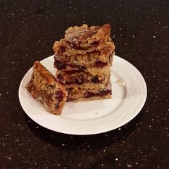 A picture of Fresh Berrie Crumble Bars with White and Milk Chocolate Glaze.