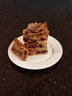 A picture of Fresh Berrie Crumble Bars with White and Milk Chocolate Glaze.
