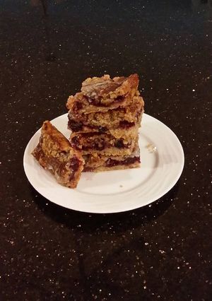 A picture of Fresh Berrie Crumble Bars with White and Milk Chocolate Glaze.