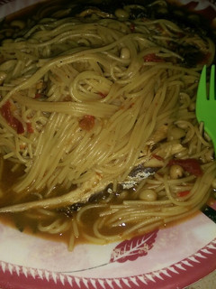 A picture of Spaghetti beans jollof wit fish.