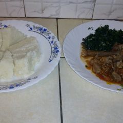 A picture of Ugali kales with beef stew.