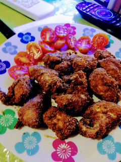 Una foto de Nuggets de pollo con tomatitos cherry