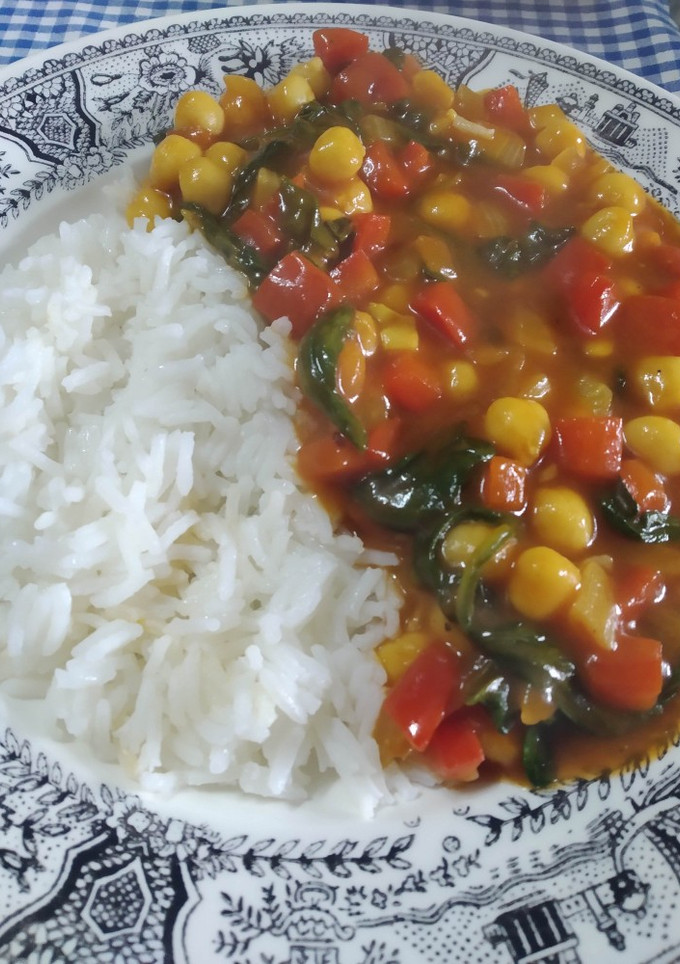 Una foto de Garbanzos con tomate y arroz