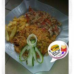 Jollof rice with Irish and scramble egg A picture of Jollof rice with Irish and scramble egg.