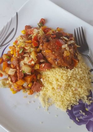 A picture of Couscous with sausage stir fry and BBQ turkey.
