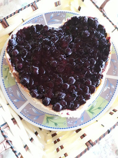 Una foto de Cheesecake de Philadelphia con salsa arándano método grez