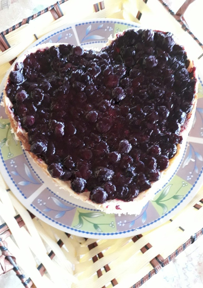 Una foto de Cheesecake de Philadelphia con salsa arándano método grez