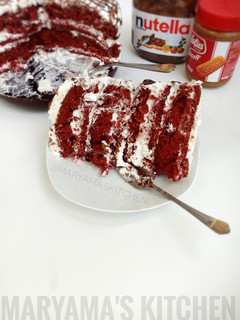 A picture of Red velvet cake with whipped cream frosting.