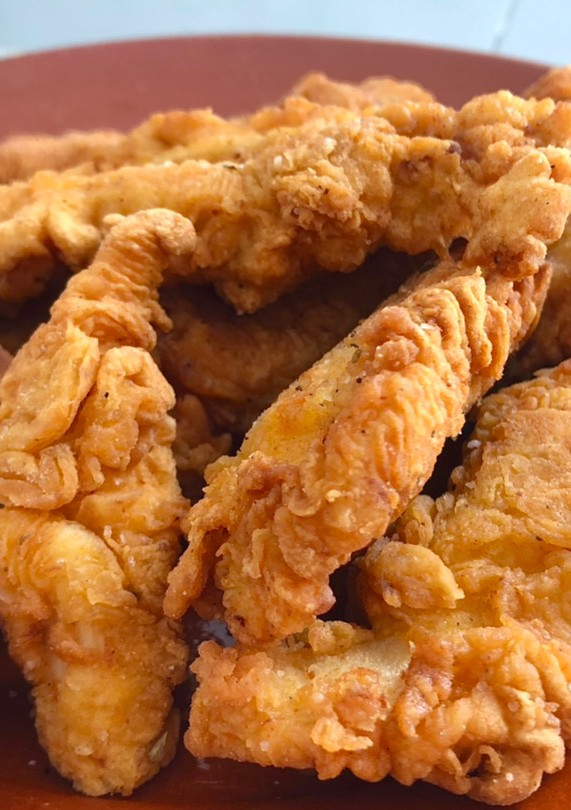 Una foto de Pollo estilo Crispy Strips KFC 🇺🇸