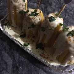 A picture of Corns with white sauce.