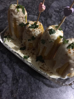 A picture of Corns with white sauce.
