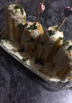 A picture of Corns with white sauce.