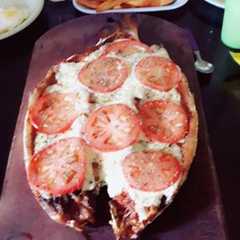 Una foto de Boga a la pizza