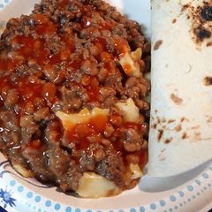 A picture of Beans, Burger, Served with Tortillas.
