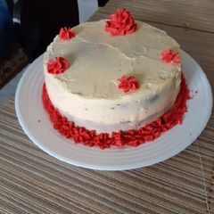 A picture of Fruit cake with orange buttercream.