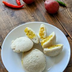 A picture of Red potato stuffed idlis.