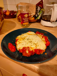 Una foto de Pollo al parmesano