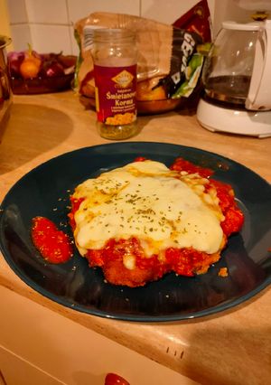 Una foto de Pollo al parmesano