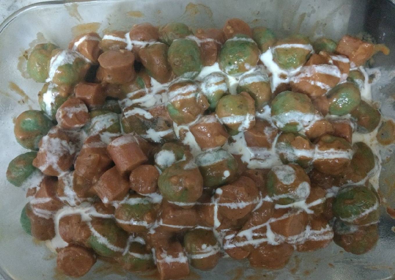 Malfattis (ñoquis de espinacas y ricota)y salsa con sachichas