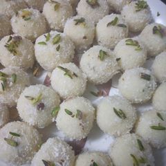 A picture of Coconut ladoo with milkmaid.