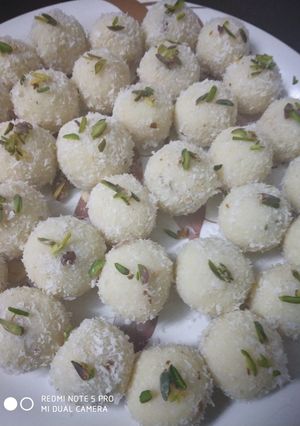 A picture of Coconut ladoo with milkmaid.