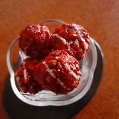 A picture of Dusky rose coconut laddoo with pan filling.
