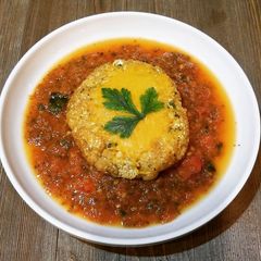 A picture of Cauliflower Cheese Burgers In A Tomato And Spinach Sauce.