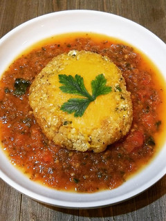 A picture of Cauliflower Cheese Burgers In A Tomato And Spinach Sauce.