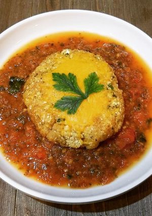 A picture of Cauliflower Cheese Burgers In A Tomato And Spinach Sauce.