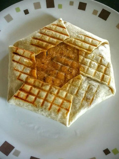 A picture of Paini press vegetarian crunch wrap.