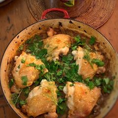 A picture of Crispy braised chicken thighs with olives, lemon and fennel.