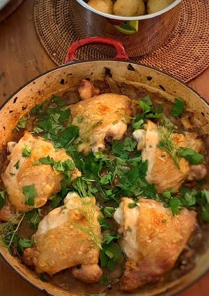 A picture of Crispy braised chicken thighs with olives, lemon and fennel.
