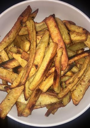 Una foto de Papas bravas sabor panceta y hierbas