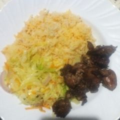 Steamed cabbage served with rice and chicken liver A picture of Steamed cabbage served with rice and chicken liver.