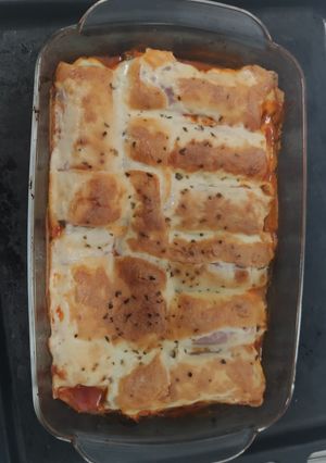 Una foto de Canelones de jamón York y verduras