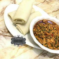 A picture of Rolled pounded yam wt egusi soup.