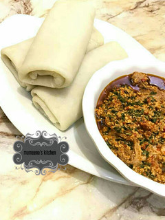 A picture of Rolled pounded yam wt egusi soup.