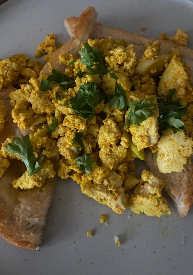 A picture of Scrambled Tofu (eggs) on toast.