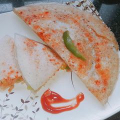 A picture of Schezwan cheese dosa.