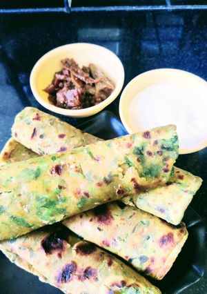 A picture of Methi gur til thepla with gobhi shaljam gajar achar and dahi.