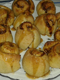 A picture of Cinnamon Rolls with Caramel Sauce and Peanut Cinnamon Filling.