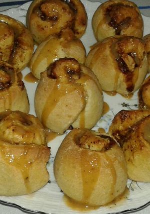 A picture of Cinnamon Rolls with Caramel Sauce and Peanut Cinnamon Filling.