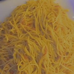 A picture of Fried spaghetti with diced pomo.