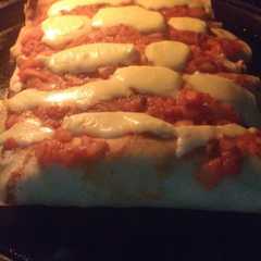 Una foto de Canelones de espinaca y pollo