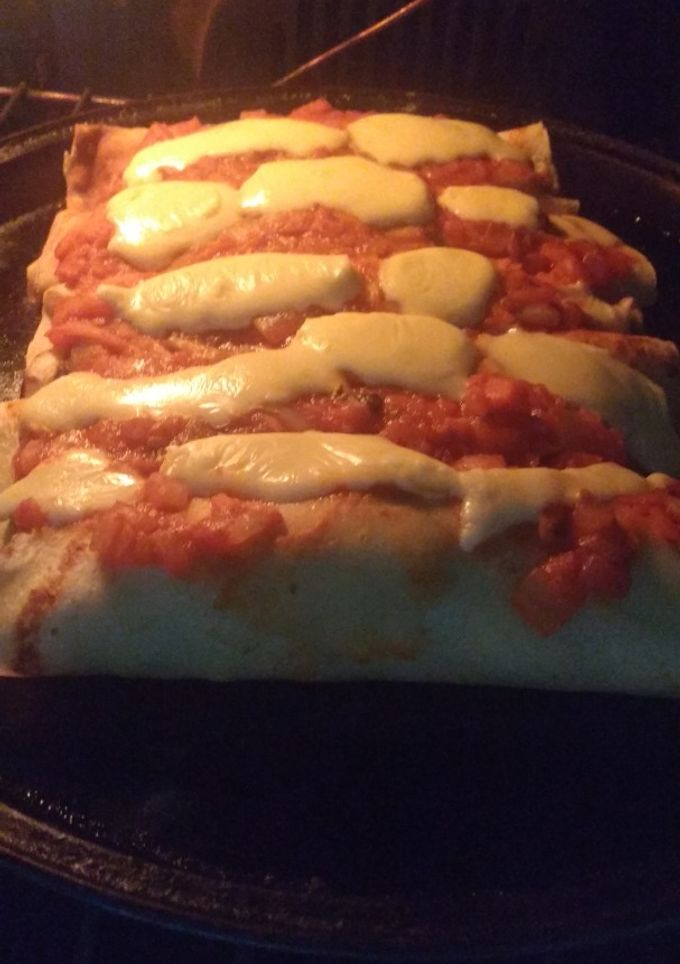 Una foto de Canelones de espinaca y pollo