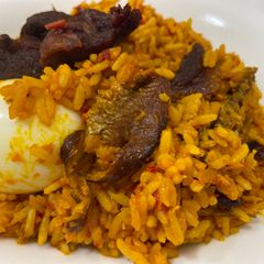 A picture of Palm oil Rice/ Native Rice.