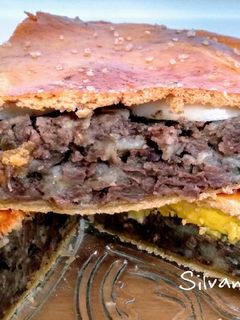 Una foto de 78.🥮Empanada de morcilla, patata, huevo🥔🥚y masa murciana