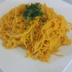 A picture of Tumeric rice with spaghetti.