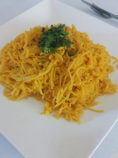 A picture of Tumeric rice with spaghetti.