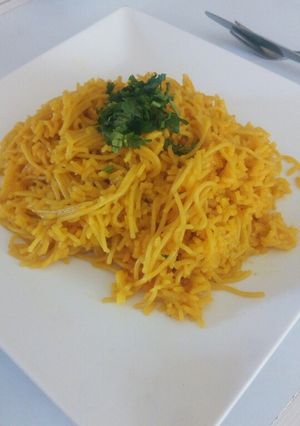 A picture of Tumeric rice with spaghetti.